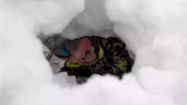 Wyatt in the snow tunnel Wyatt peeking through a bright white snow tunnel.