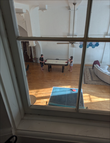 Kids playing in the warehouse of the cedar beach inn The kids are were playing some early morning air hockey in the warehouse of the cedar beach inn.