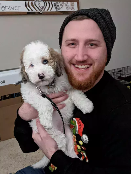 Waylon sitting with Dobby on his first day home