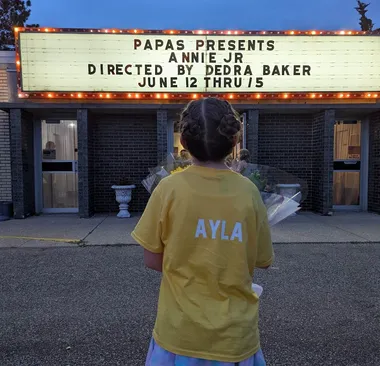 Ayla Looking at the Annie Jr Marquee Ayla looks up at the fully lit marquee sign for Annie Jr after the first nights performance.