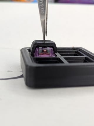 cut away keycap down A cut away keycap on a Durock lupine switched pressed all the way to bottom out.