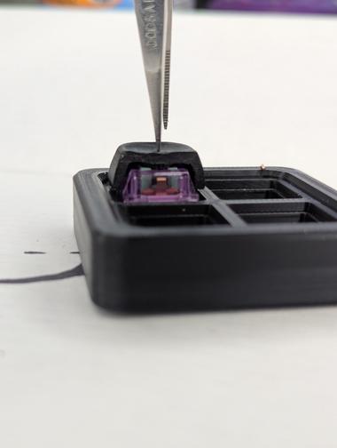 cut away keycap down A cut away keycap on a Durock lupine switched pressed all the way to bottom out.