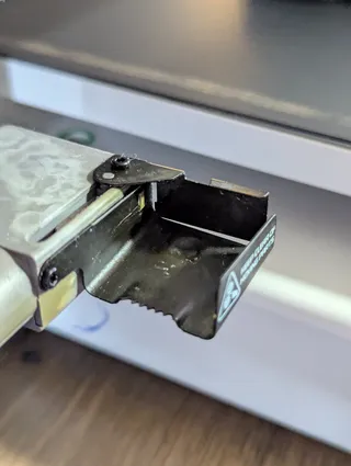 bambu poop flinger jammed My bambu A1 poop flinger has been getting jammed up for awhile now, here is an image of it in the jammed position.