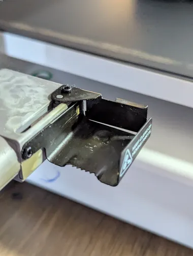 bambu poop flinger jammed My bambu A1 poop flinger has been getting jammed up for awhile now, here is an image of it in the jammed position.